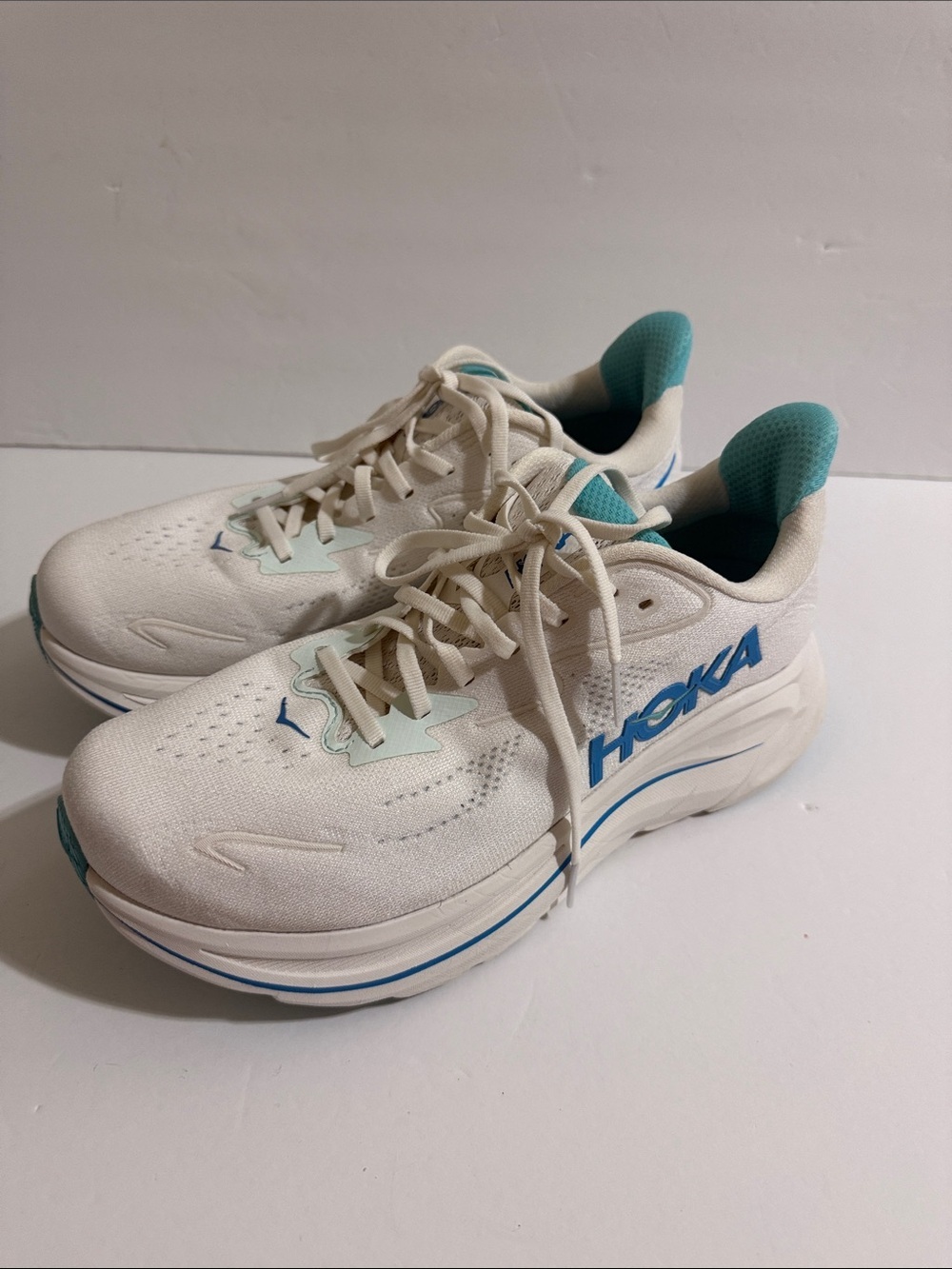 Hoka Men's White Sneakers with Teal and Blue Accents